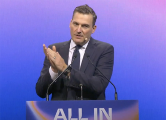 Evan Solomon, Canada's Minister of Artificial Intelligence and Digital Innovation, delivering opening remarks at ALL IN 2026.